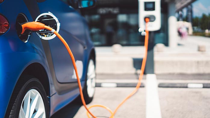A plug-in EV charging at a public charging port