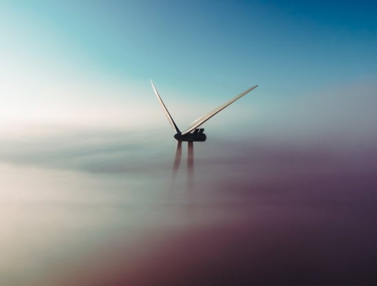 Windmill covered by clouds